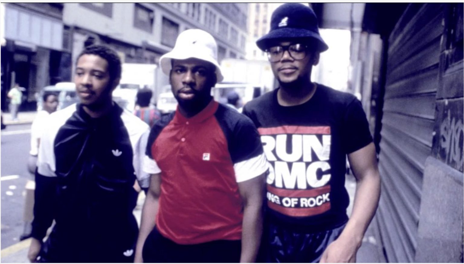 RUN-DMC standing together on a city street.