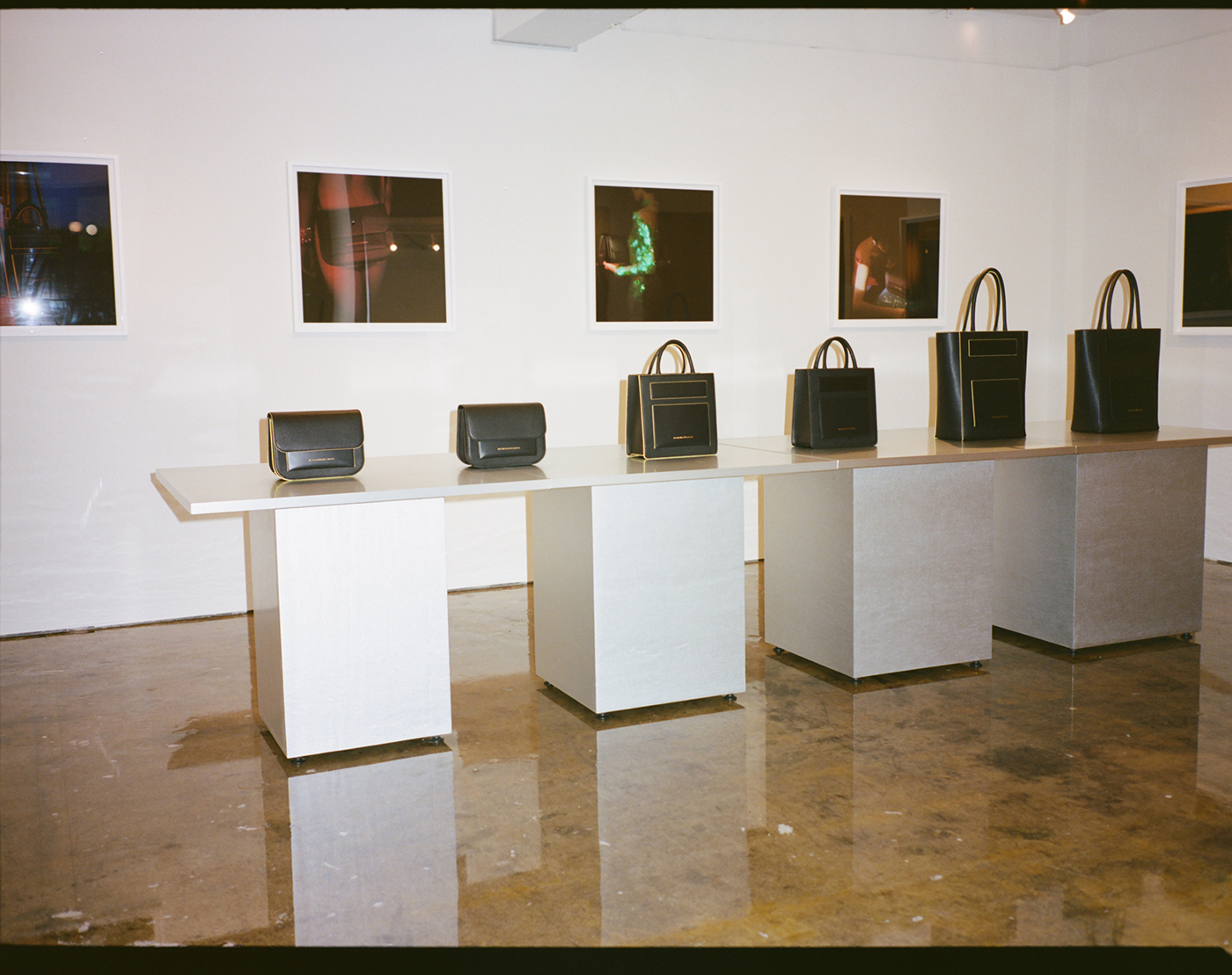 STEIN BOX exhibition space with product display and photographs.